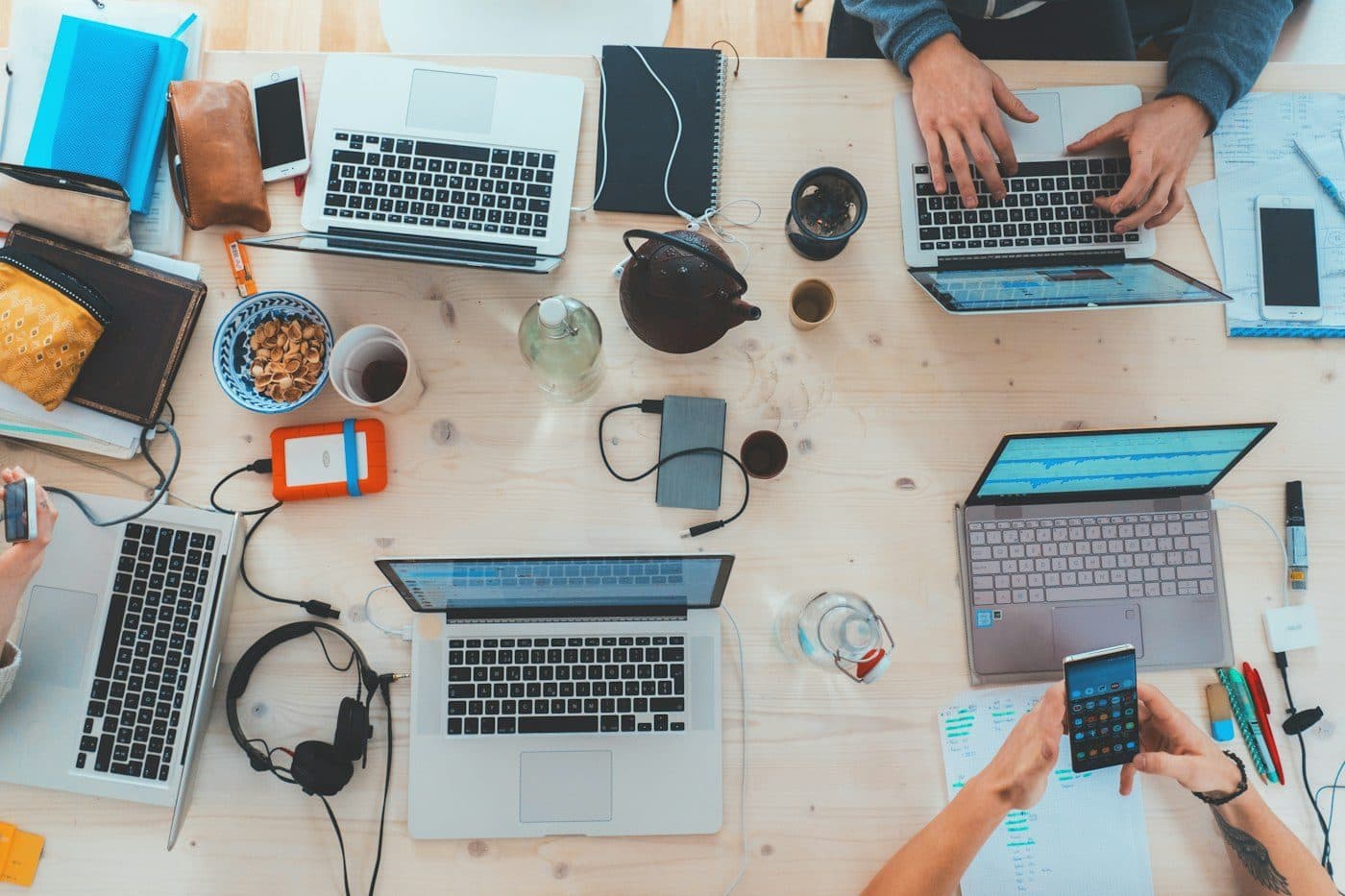 Developer writing code on a dual-monitor setup at home