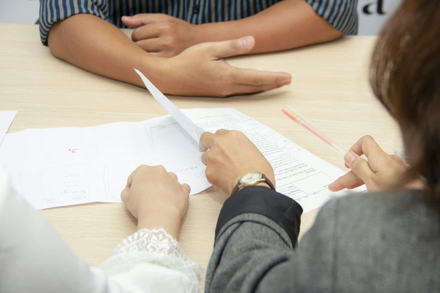 Hiring manager reviewing a developer's resume during an interview