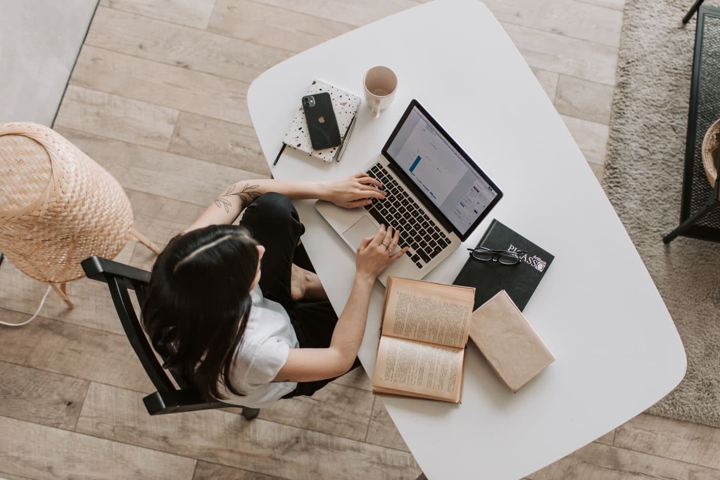 Remote developer's home office desk with headphones and laptop
