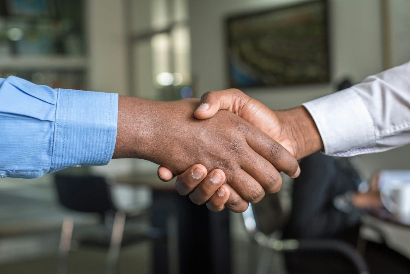 Handshake closing a remote hiring agreement